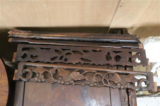 A Chinese nest of three carved hardwood tea tables, each with pierced frieze W.45cm approx.